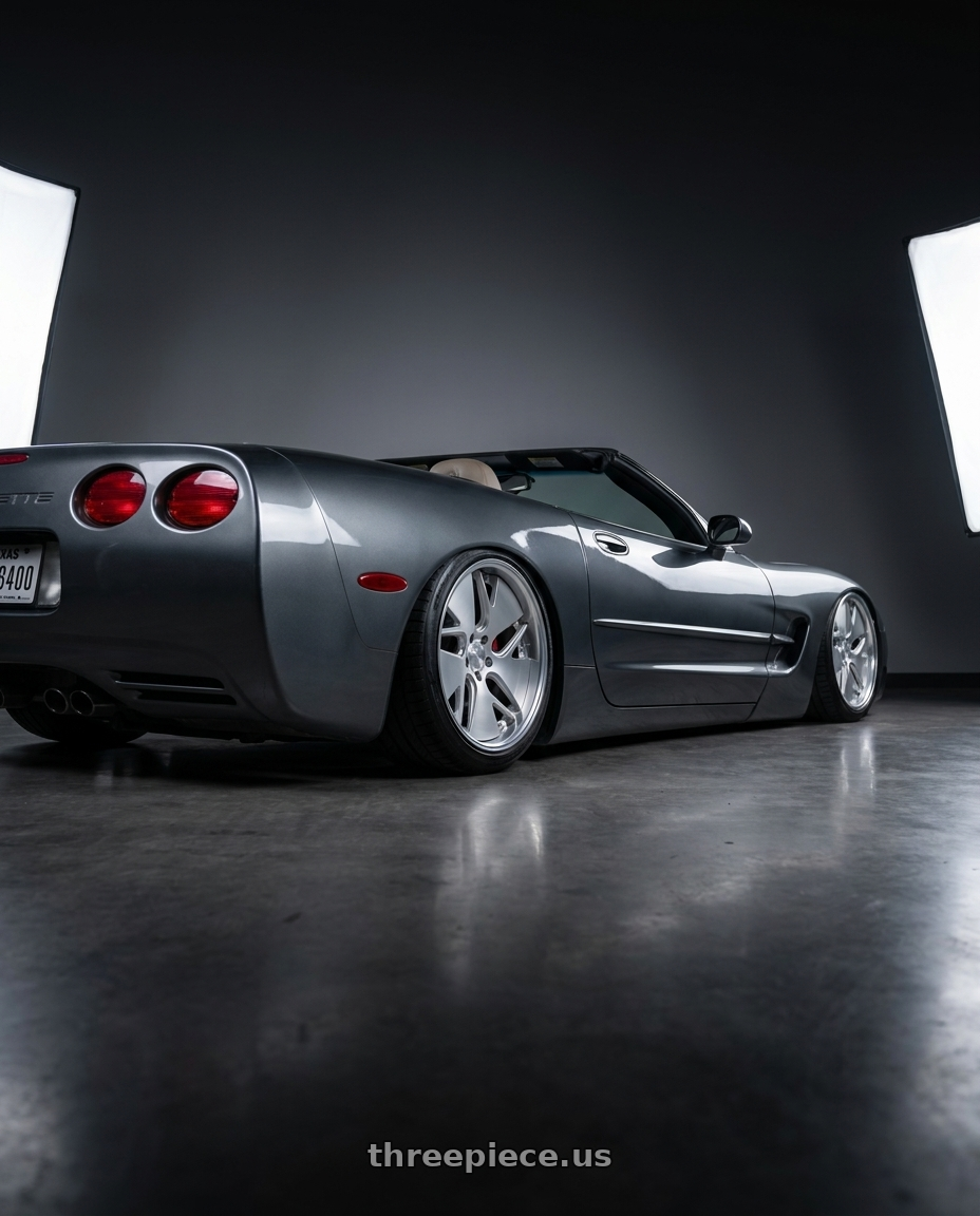 2004 Chevrolet corvette with Work Gnosis Cvd 5x120.65 20x9+45 W Disk Matte Silver wheels rear three quarter view slight stretch tires