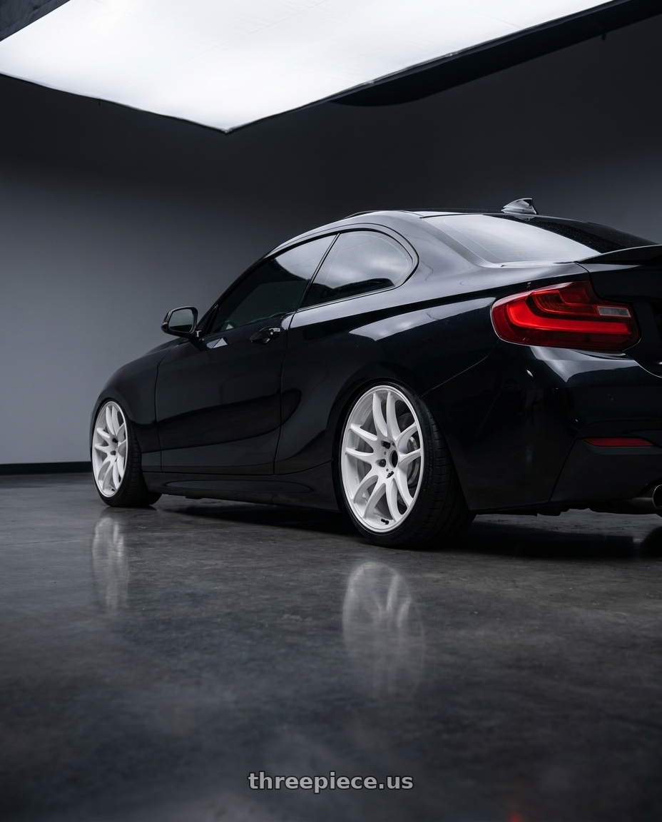 2015 bmw m235i with Work Emotion Cr Kiwami 5x120 18x8.5 +38 White wheels rear three quarter view slight stretch tires