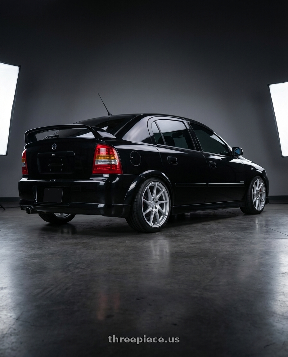 2008 Chevrolet astra advantage Black  with Aodhan AH09 5x114.3 18x8.5 +35 Gloss Silver Machined Face wheels rear three quarter view square tires