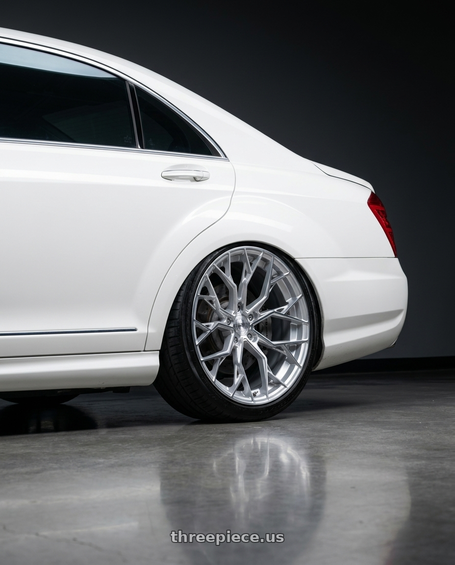 2009 Mercedes s63 with DOLCE PERFORMANCE ARIA 5x112 20x10 +40 Gloss Silver Machined Face wheels rear three quarter view slight stretch tires