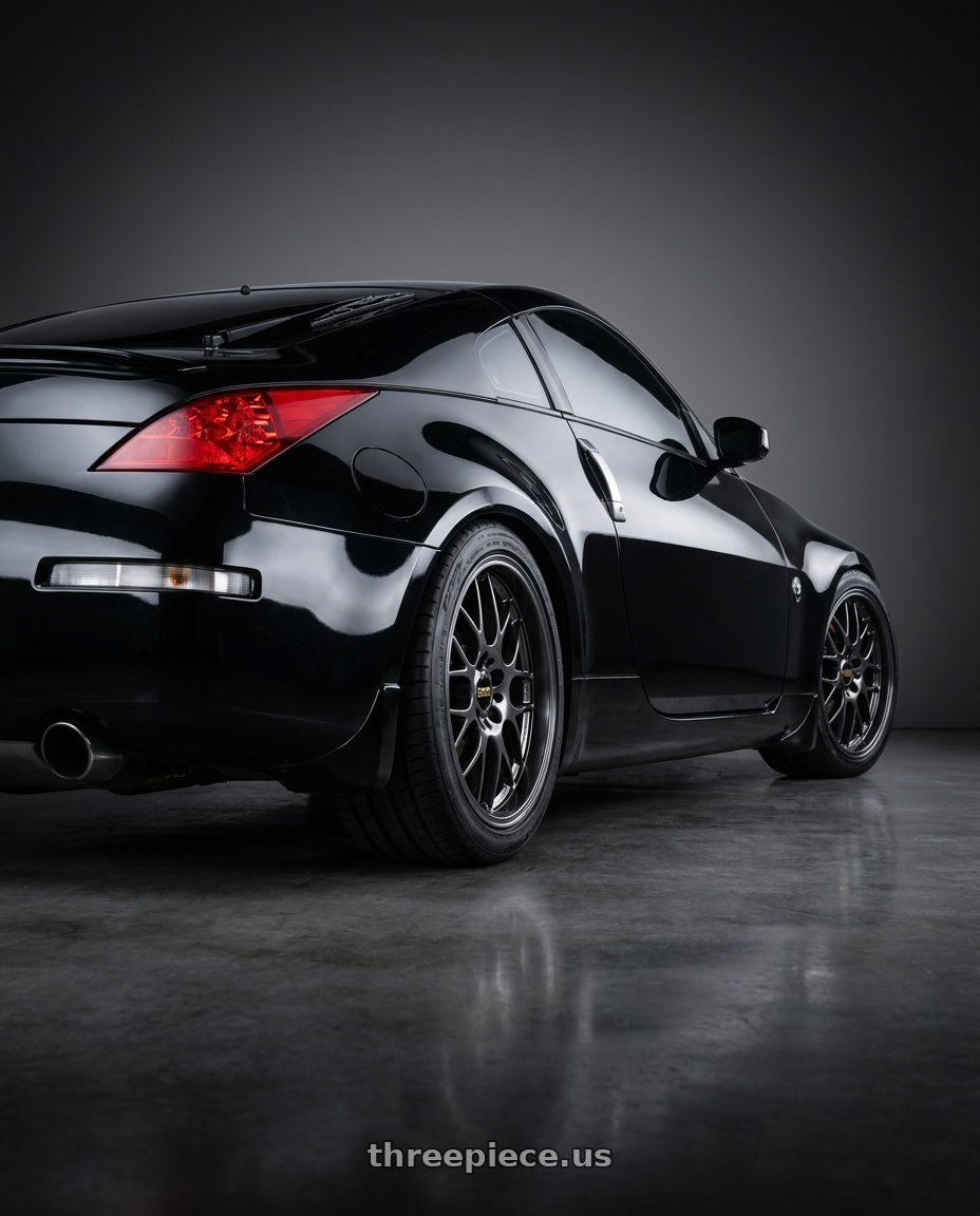 2006 Nissan 350Z Super black with BBS RG-R 5x114.3 19x9.5+22 Diamond Black wheels rear three quarter view square tires