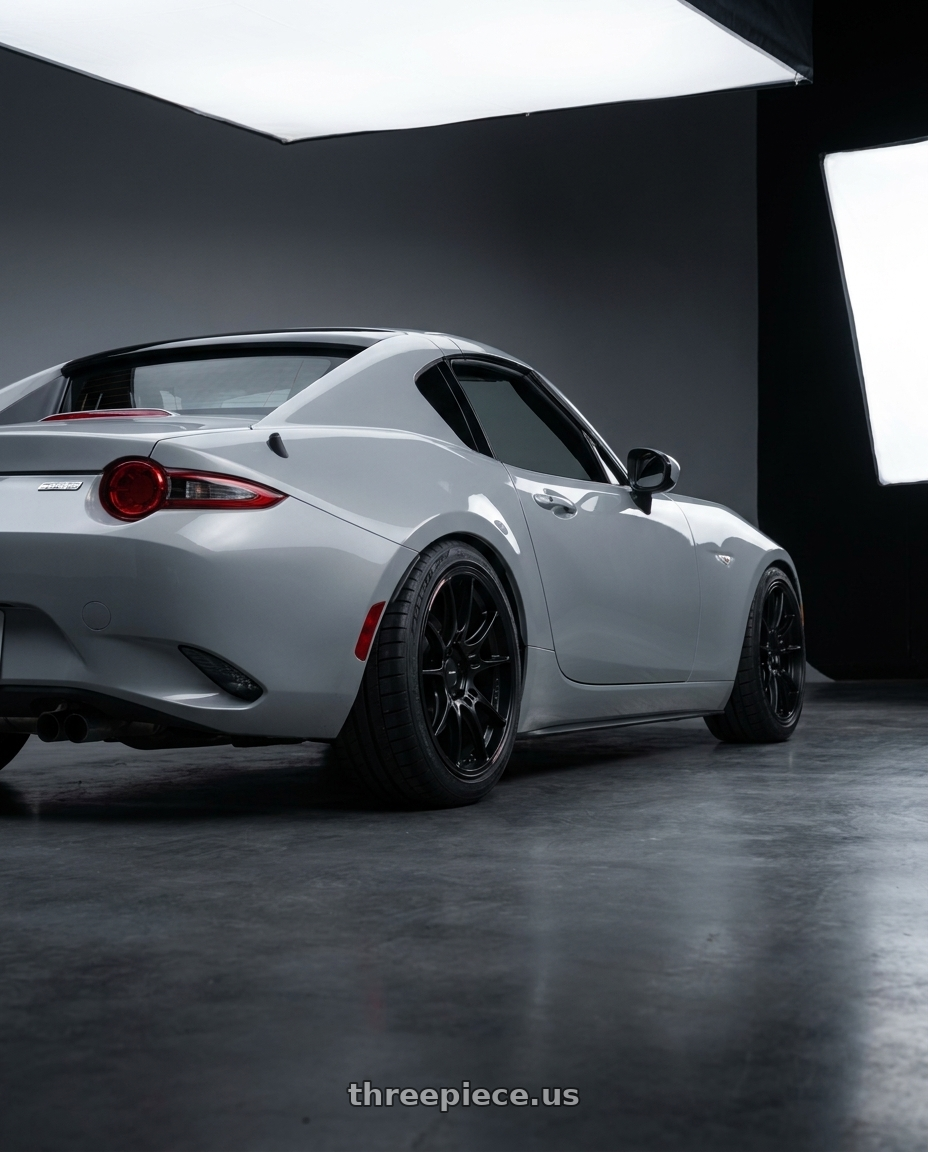 2025 mazda mx5rf nd3 with Enkei GTC02 4x100 17x7.5+35 Black wheels rear three quarter view square tires