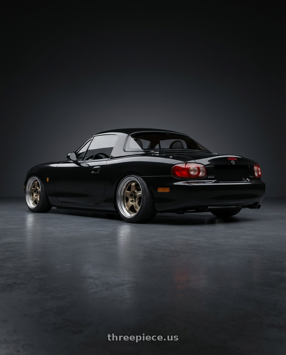 2001 Mazda MX-5 NBFL with Work Meister S1 2P 4x100 15x8+22 A Disk Titanium Gold wheels rear three quarter view slight stretch tires
