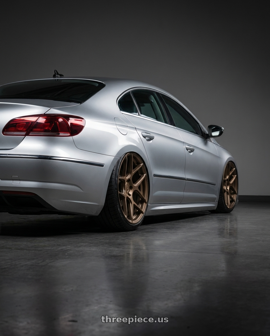 2015 Volkswagen CC with Aodhan AFF2 5x112 19x8.5+35 Matte Bronze wheels rear three quarter view slight stretch tires