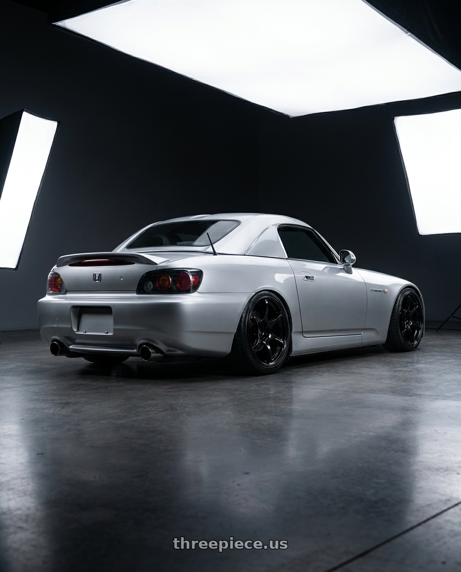 2009 Honda S2000 with Advan RGIII 5x114.3 17x9.0+45 Gloss Black wheels rear three quarter view slight stretch tires