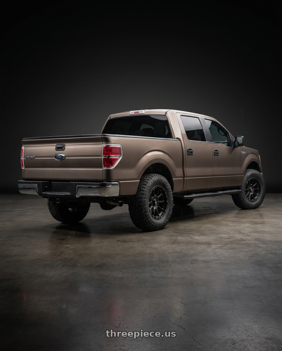 2013 Ford F-150 with KMC KM100 SYNC 6X135/6X139.7 20X9 +18 SATIN BLACK wheels rear three quarter view meaty tires