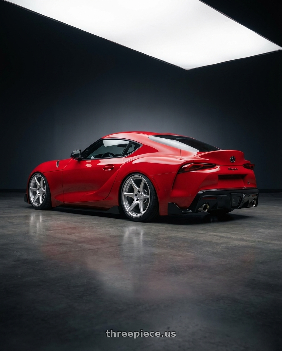 2023 Toyota GR Supra with Kansei K11S Tandem 5X112 19x9.5 22 Hyper Silver wheels rear three quarter view slight stretch tires