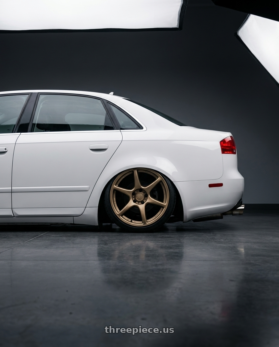 2010 Audi A4 B7 with Kansei K11B Tandem 5X112 18x8.5 35 Bronze wheels rear three quarter view slight stretch tires