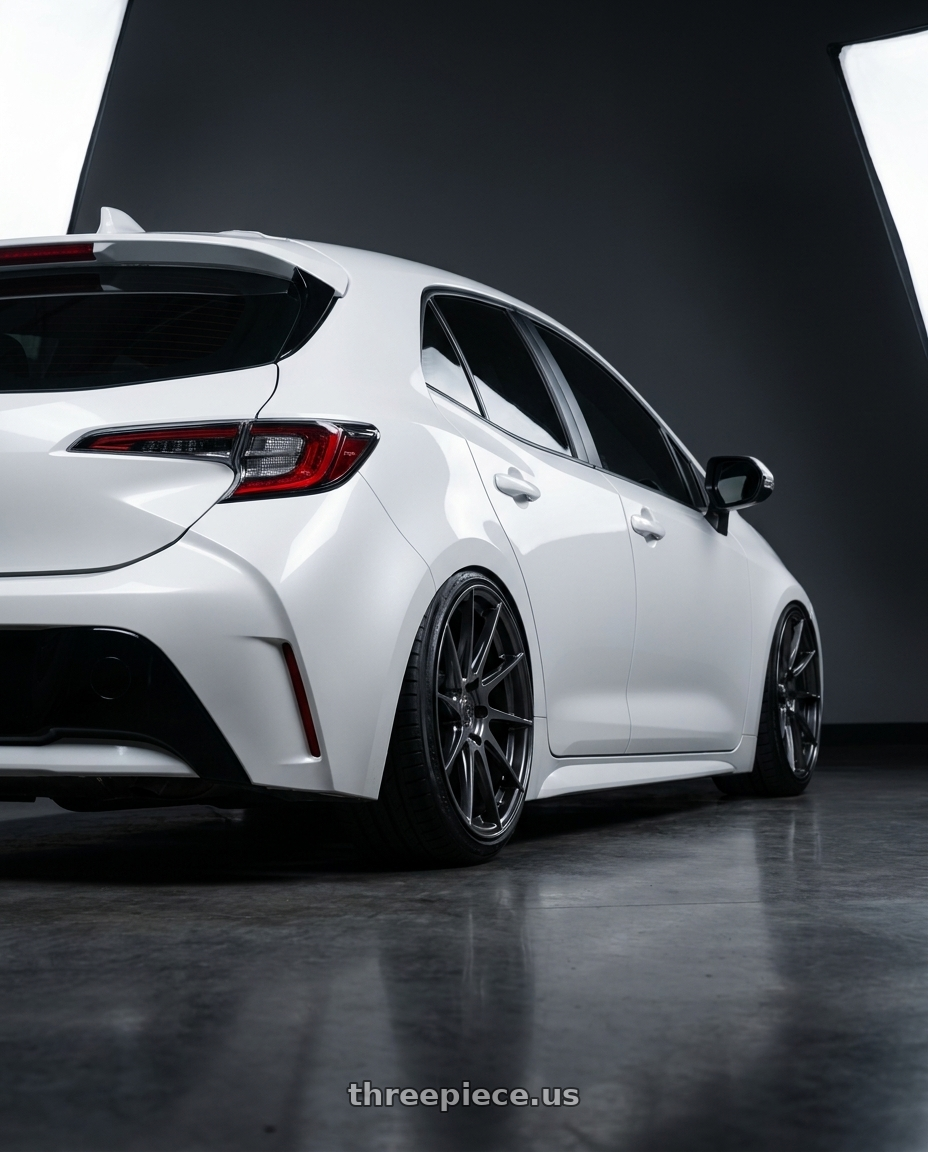 2023 Toyota Corolla Hatchback with Aodhan AH09 5x114.3 18x8.5 +35 Hyper Black wheels rear three quarter view slight stretch tires