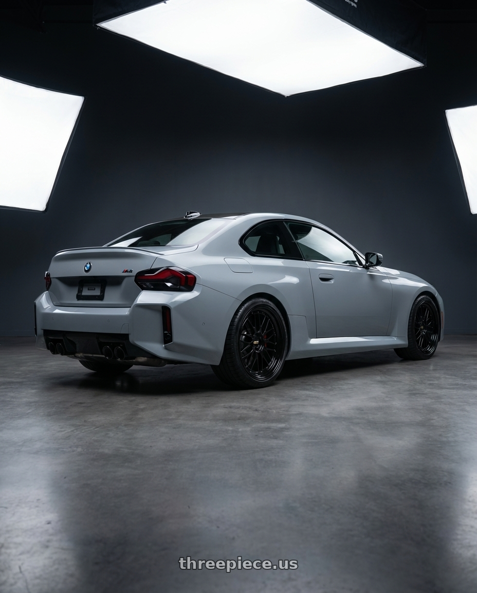2025 bmw m2  with BBS LM 5x120 20x9.0+15 Diamond Black wheels rear three quarter view square tires