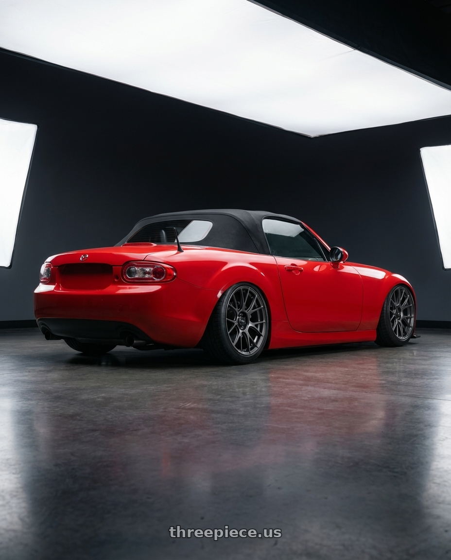 2012 Mazda MX-5 Miata NC with Konig Ampliform 5x114.3 17x9+40 Dark Metallic Graphite wheels rear three quarter view slight stretch tires