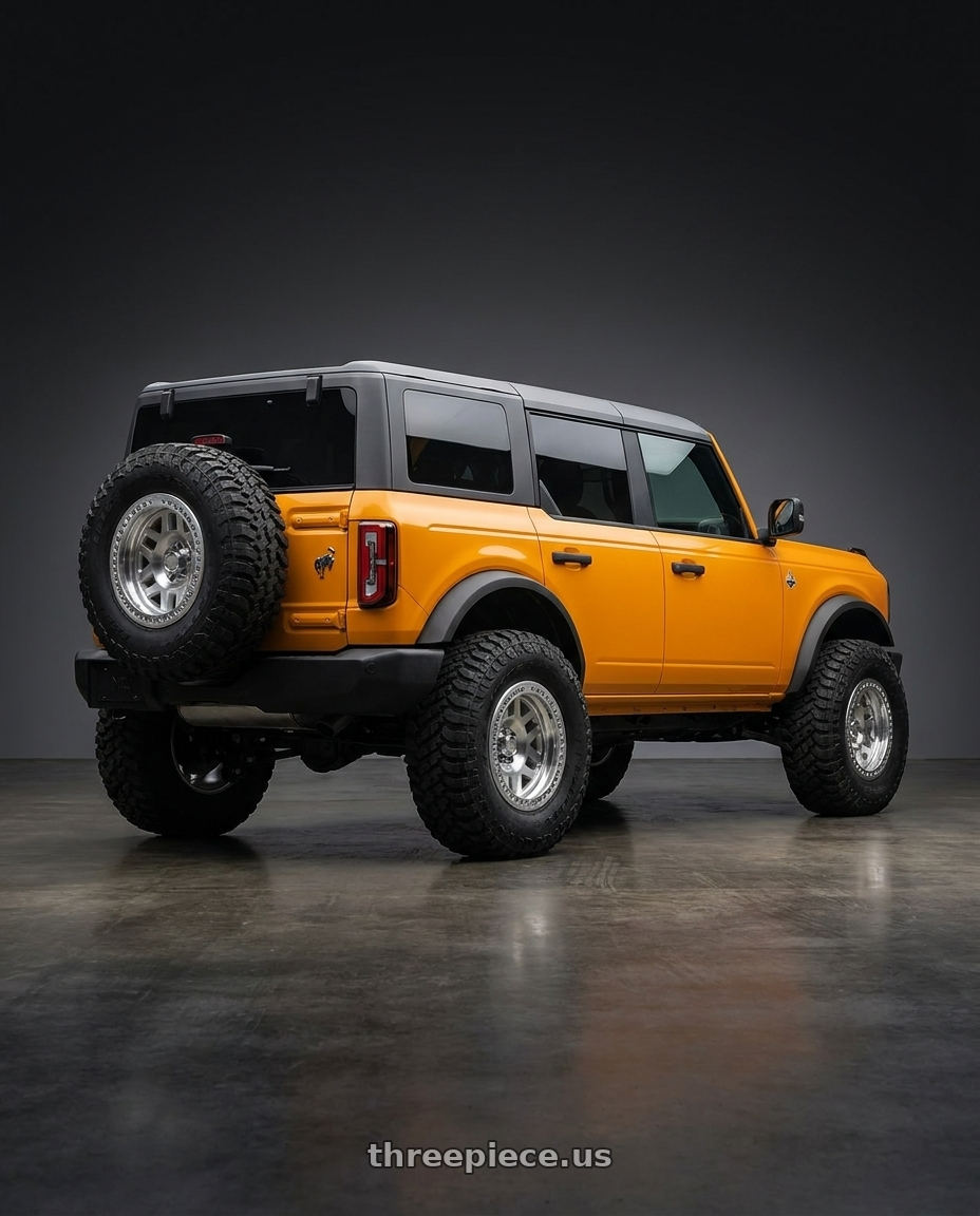 2024 Ford Bronco with KMC KM229 MACHETE CRAWL BEADLOCK 6X139.7 17X9 -38 MACHINED wheels rear three quarter view meaty tires