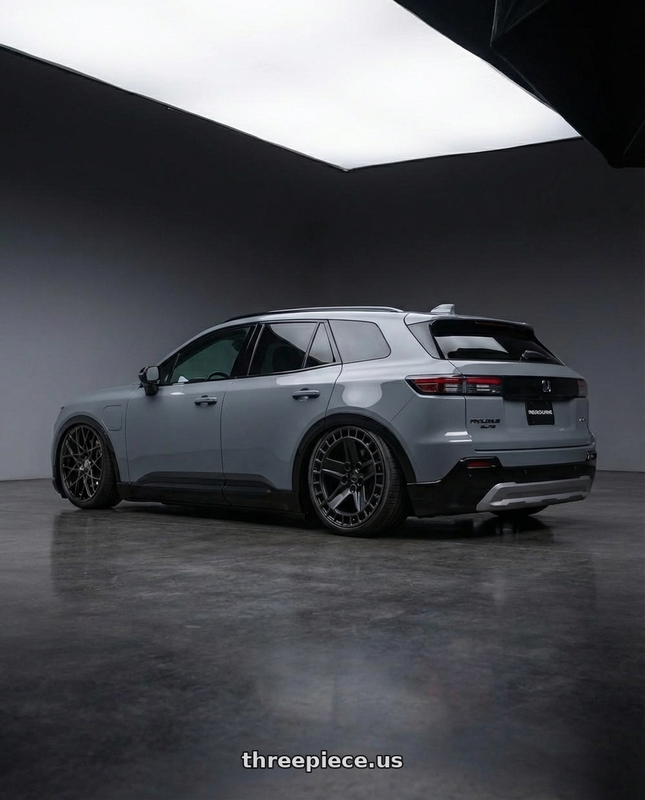 2025 honda prolouge elite grey with RedBourne ALSTON 5X120 20X8.5 +25 MATTE BLACK W/ MACHINED DARK TINT LIP wheels rear three quarter view slight stretch tires