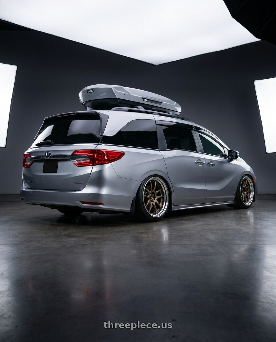 2024 Honda Odyssey with Work Cr 2P 5x120 20x8.5 +45 Matte Bronze wheels rear three quarter view slight stretch tires