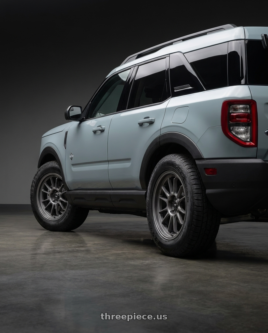 2025 Ford Bronco Sport Outer Banks with Konig Hypergram 5x108 18x8.5+43 Matte Grey wheels rear three quarter view meaty tires