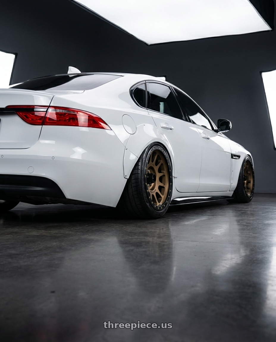 2017 Jaguar XF-s with Method Race Wheels 305BZ NV 6x139.7 18x9 -12 METHOD BRONZE wheels rear three quarter view slight stretch tires