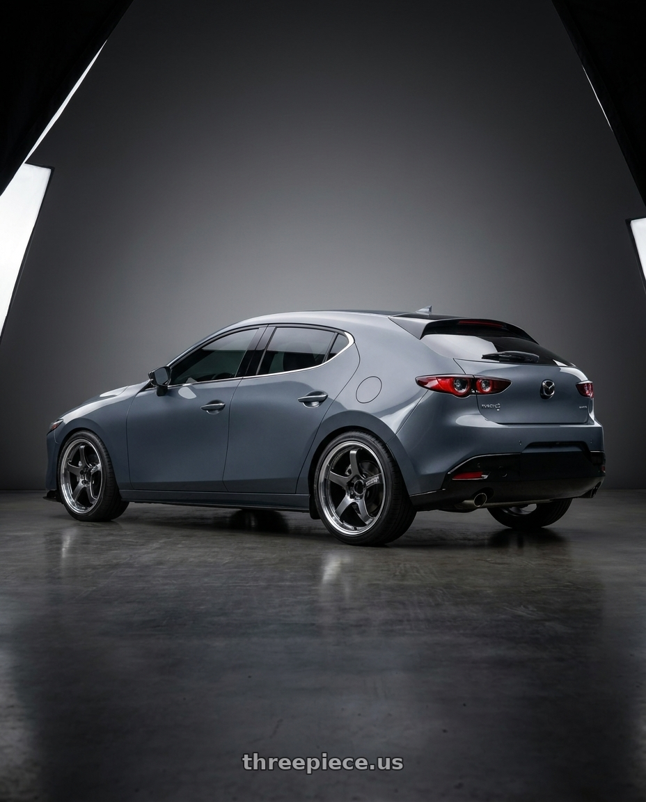 2023 mazda3 5d signature carbon packge Polymetal Grey Metallic with Advan Racing GT BEYOND 5x114.3 18x8.0 +44 MACHINING & HYPER PLATINUM BLACK wheels rear three quarter view slight stretch tires