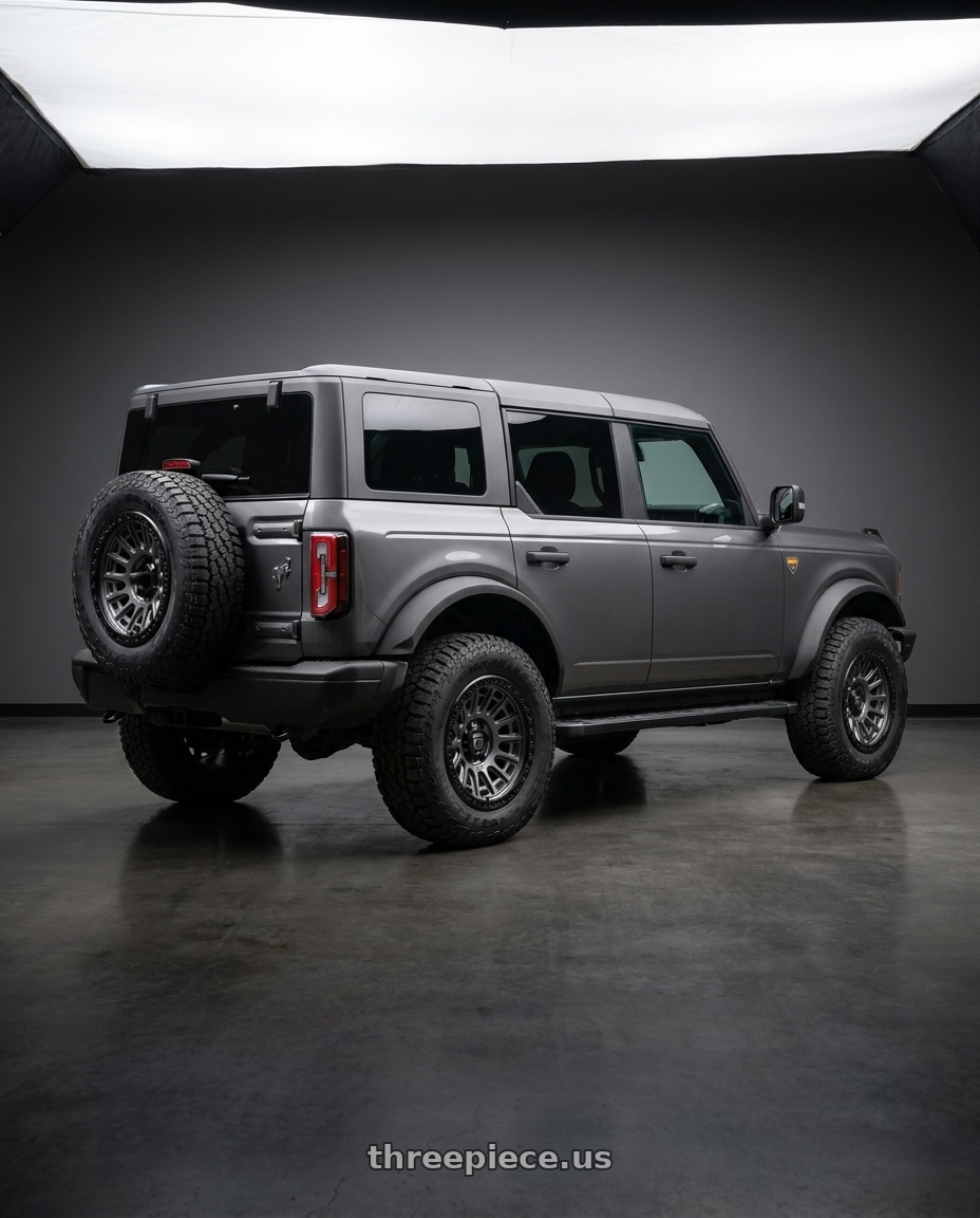 2023 Ford Bronco Badlands with Fuel 1PC D835 CYCLE 6X139.7 17X8.5 +25 MATTE GUNMETAL WITH BLACK RING wheels rear three quarter view square tires
