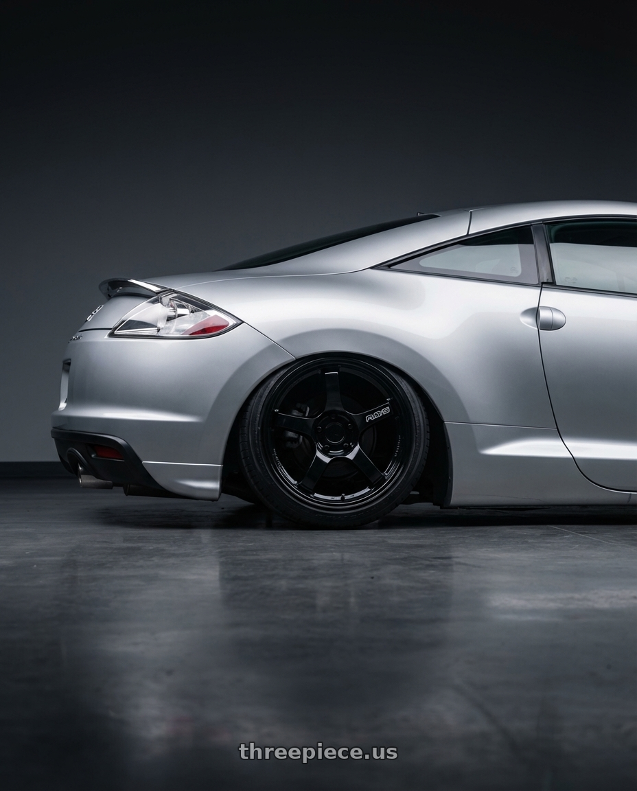 2010 Mitsubishi Eclipse with Gram Lights 57CR 5x114.3 19x10.5+12 Glossy Black wheels rear three quarter view slight stretch tires