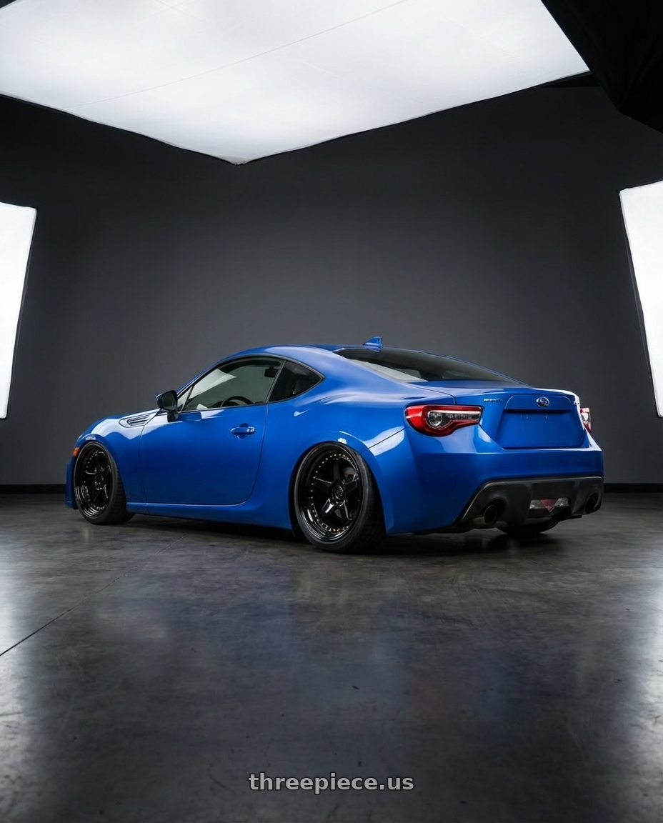 2017 Subaru BRZ with Aodhan DS05 5x100 18x9.5+35 Gloss Black W /Gold Rivets wheels rear three quarter view slight stretch tires