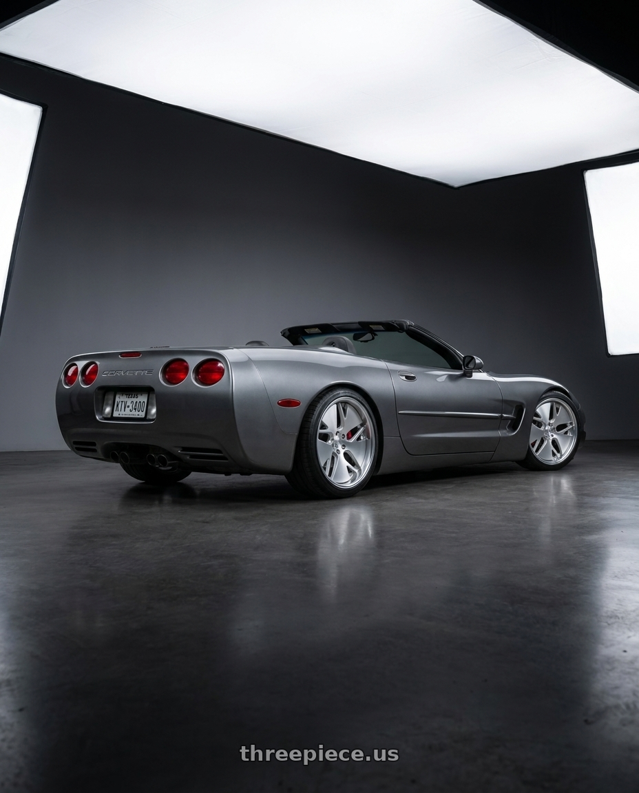 2004 Chevrolet corvette with Work Gnosis Cvd 5x120.65 19x9+45 O Disk Matte Silver wheels rear three quarter view slight stretch tires