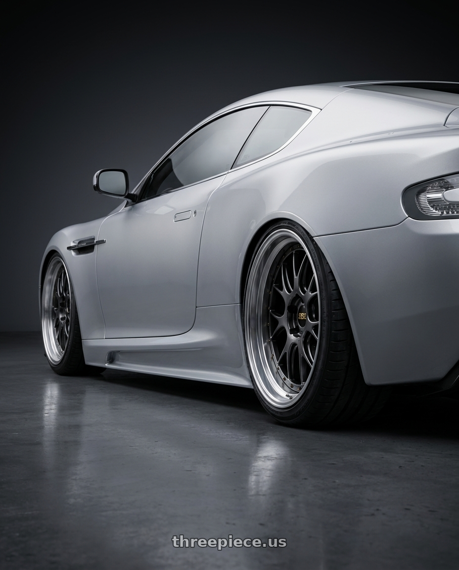 2009 Aston Martin DBS with BBS LM-R 5x114.3 19x9.5+38 Diamond Black wheels rear three quarter view slight stretch tires