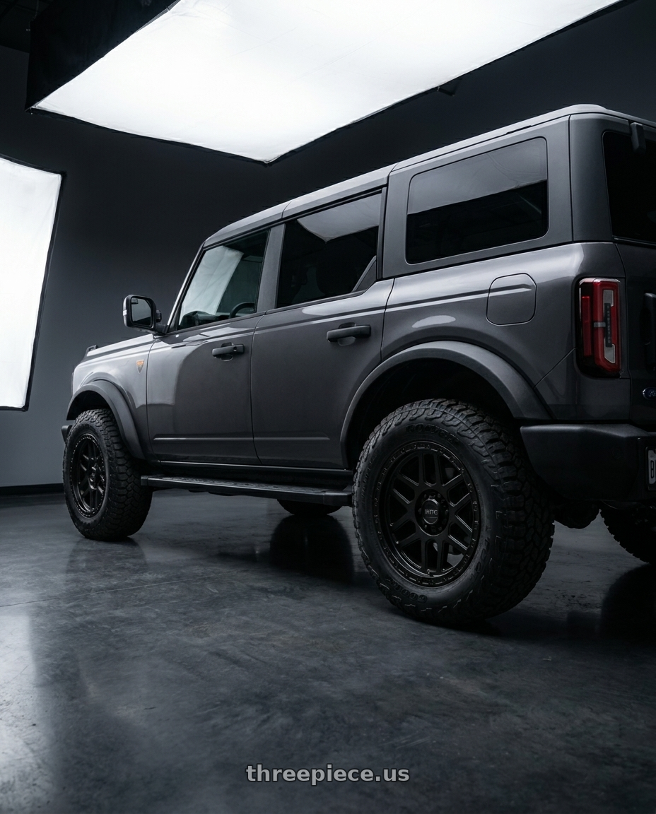 2023 Ford Bronco with KMC KM544 MESA 6X139.7 17X9 +18 SATIN BLACK WITH GLOSS BLACK LIP wheels rear three quarter view square tires