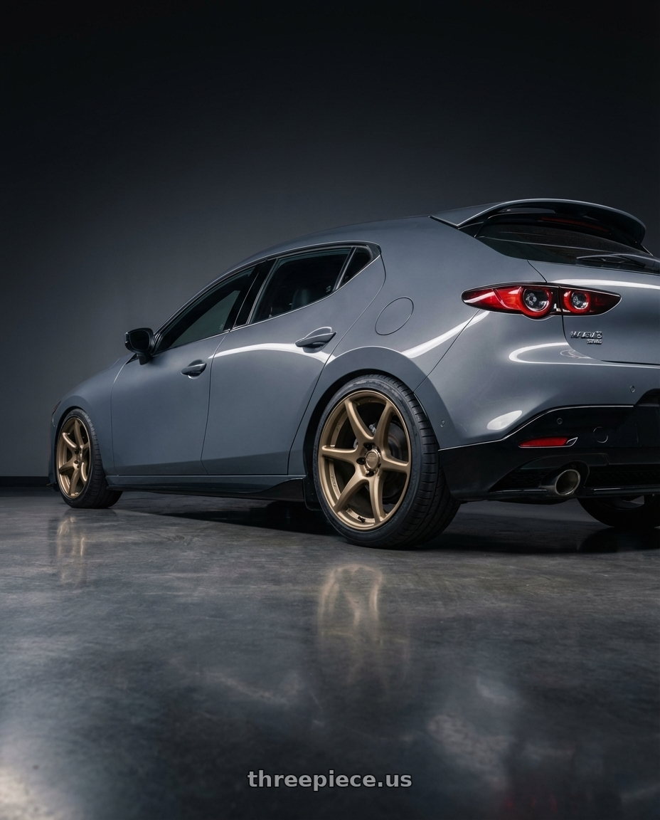2023 Mazda Mazda3 Turbo with Kansei K11B Tandem 5x114.3 18x10.5 12 Bronze wheels rear three quarter view square tires