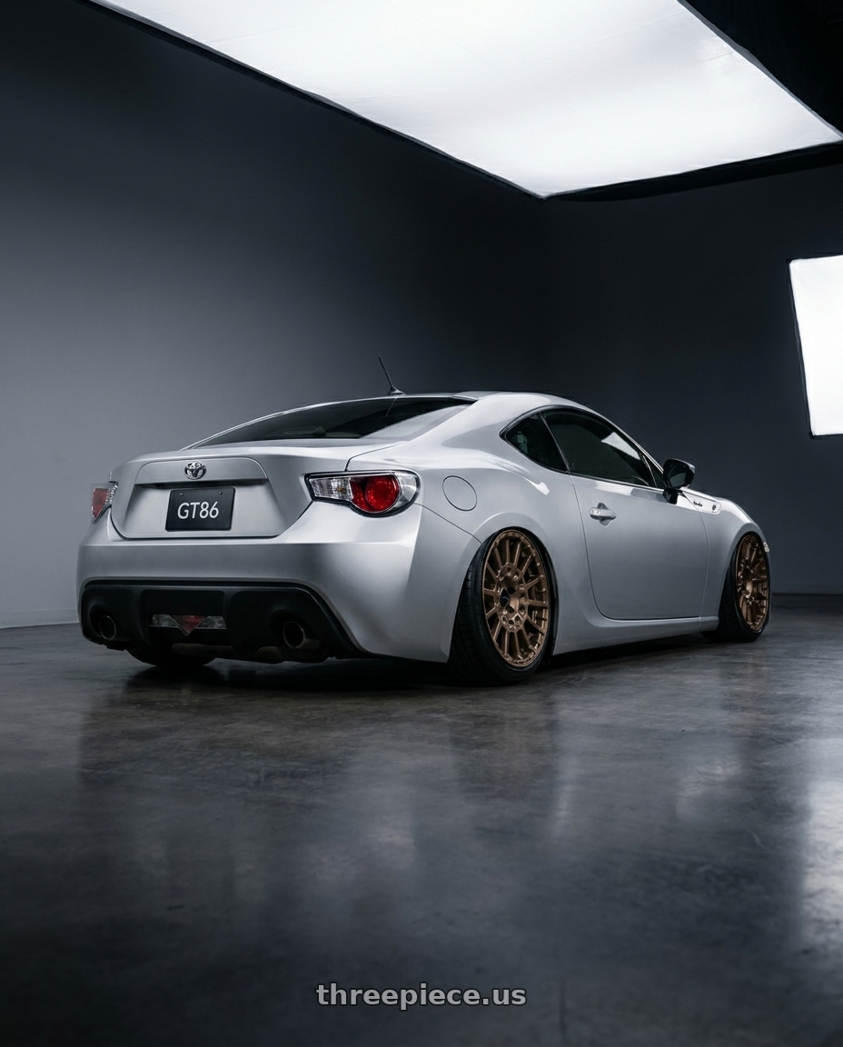 2012 Toyota GT86  with Enkei Overlander 5x100 18x8+35 Gloss Bronze wheels rear three quarter view slight stretch tires