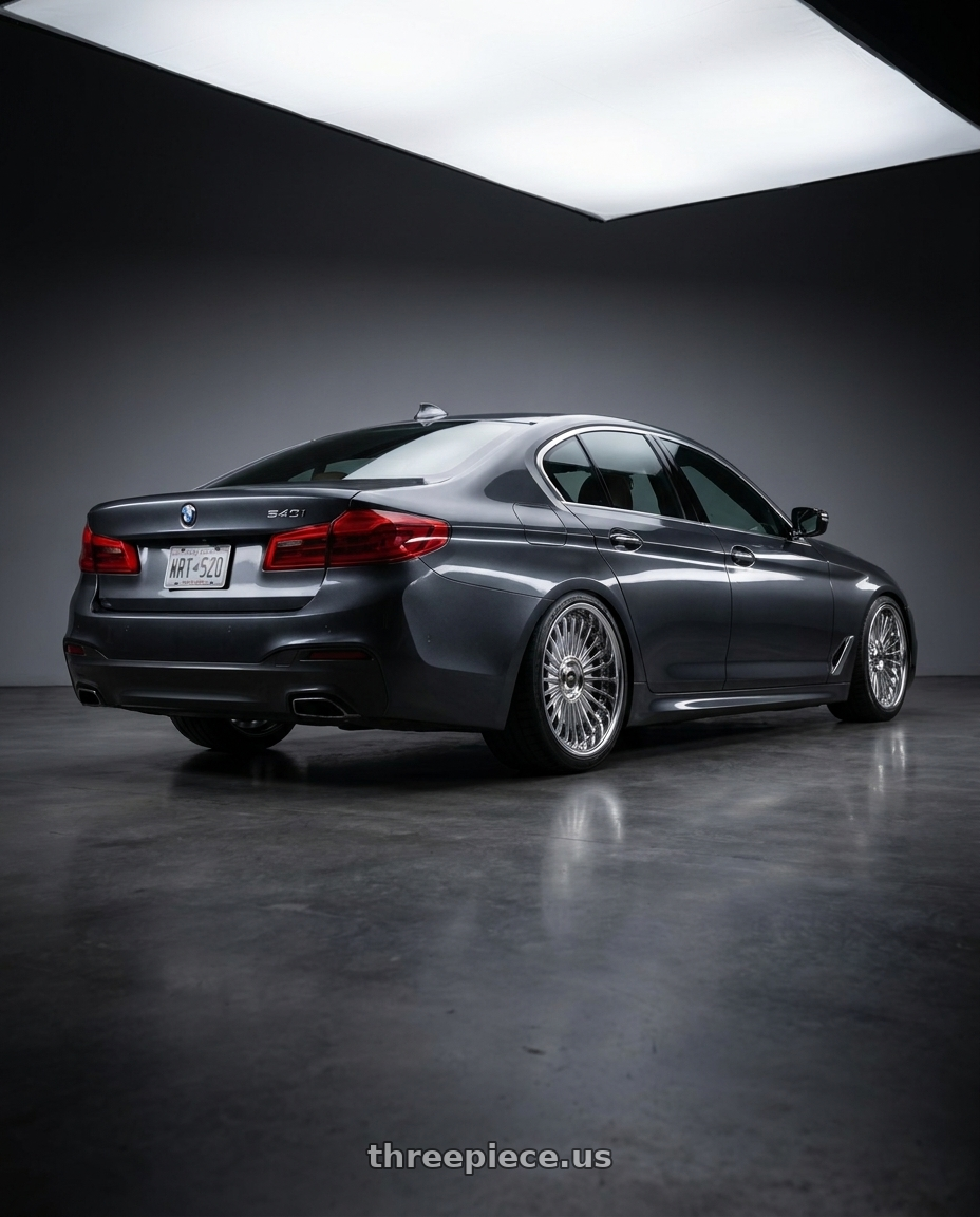 2017 BMW 540i with Work Emitz Chrome 5x112 19x9.5 +38 wheels rear three quarter view square tires
