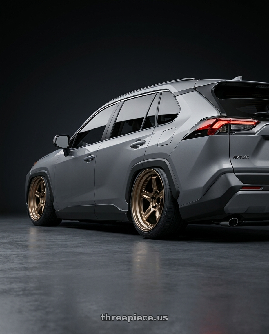 2026 Toyota Rav4 ,Gray with Volk Racing 21C SPEC-SR 5x100 18x9 +30 SHINING BRONZE METAL wheels rear three quarter view slight stretch tires