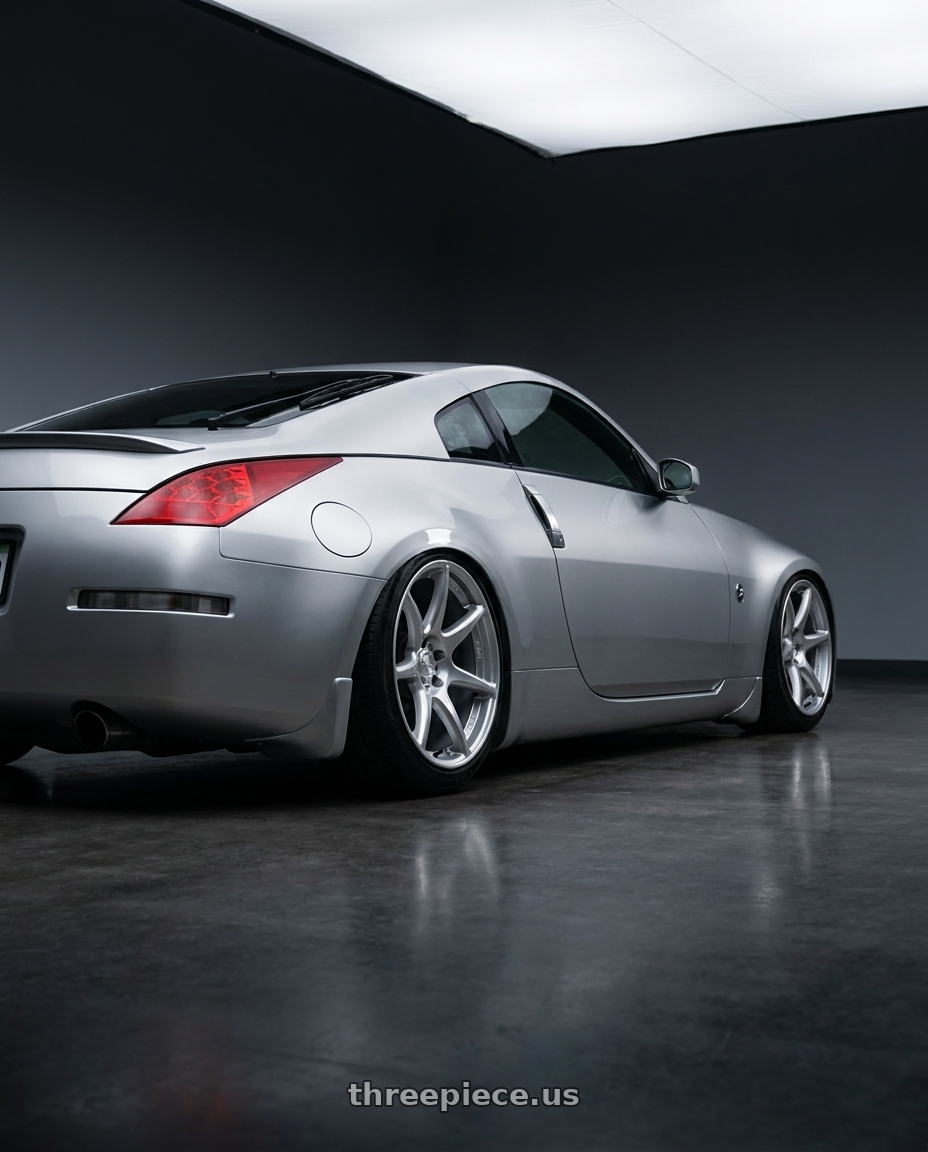 2005 Nissan 350z with Kansei K11S Tandem 5X100 18x9.5 22 Hyper Silver wheels rear three quarter view slight stretch tires