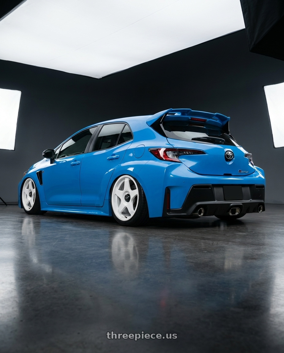 2024 Toyota GR Corolla with fifteen52 CHICANE 5x114.3 / 5x100 18x8.5 +35 RALLY WHITE (GLOSS WHITE) wheels rear three quarter view slight stretch tires
