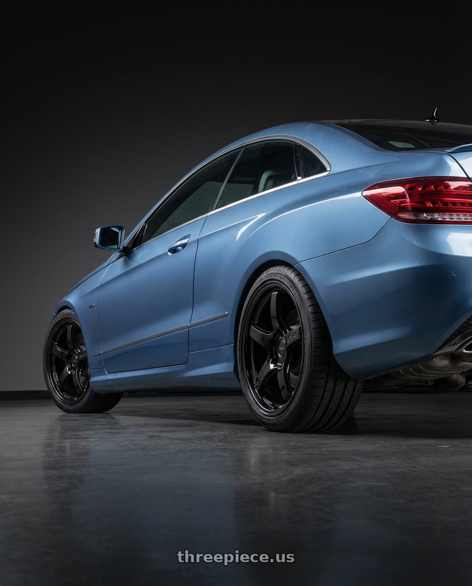 2014 Mercedes-Benz E-Class Coupe C207 with Gram Lights 57CR 5x112 19x9.5+25 Glossy Black wheels rear three quarter view square tires
