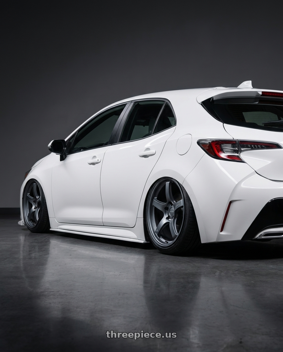 2023 Toyota Corolla Hatchback with Gram Lights 57CR 5x114.3 18x8.5+37 Gunblue II wheels rear three quarter view slight stretch tires