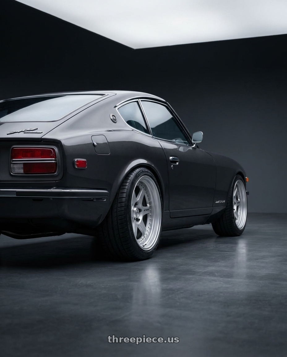 1973 datsun 240z with Work Meister L1 3P 5x108 18x13-32 A Disk Matte Silver wheels rear three quarter view square tires