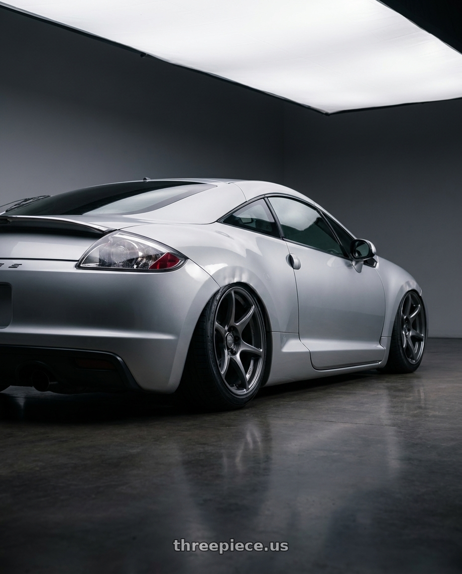 2010 Mitsubishi Eclipse with Kansei K11G Tandem 5x114.3 18x9 35 Gunmetal wheels rear three quarter view slight stretch tires