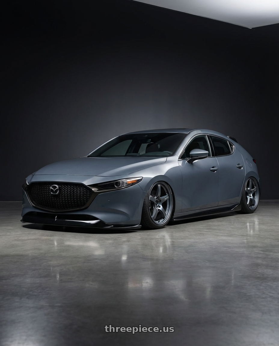 2023 Mazda Mazda3 Turbo with Gram Lights 57CR 5x114.3 18x9.5+22 Gunblue II wheels front three quarter view stanced stance