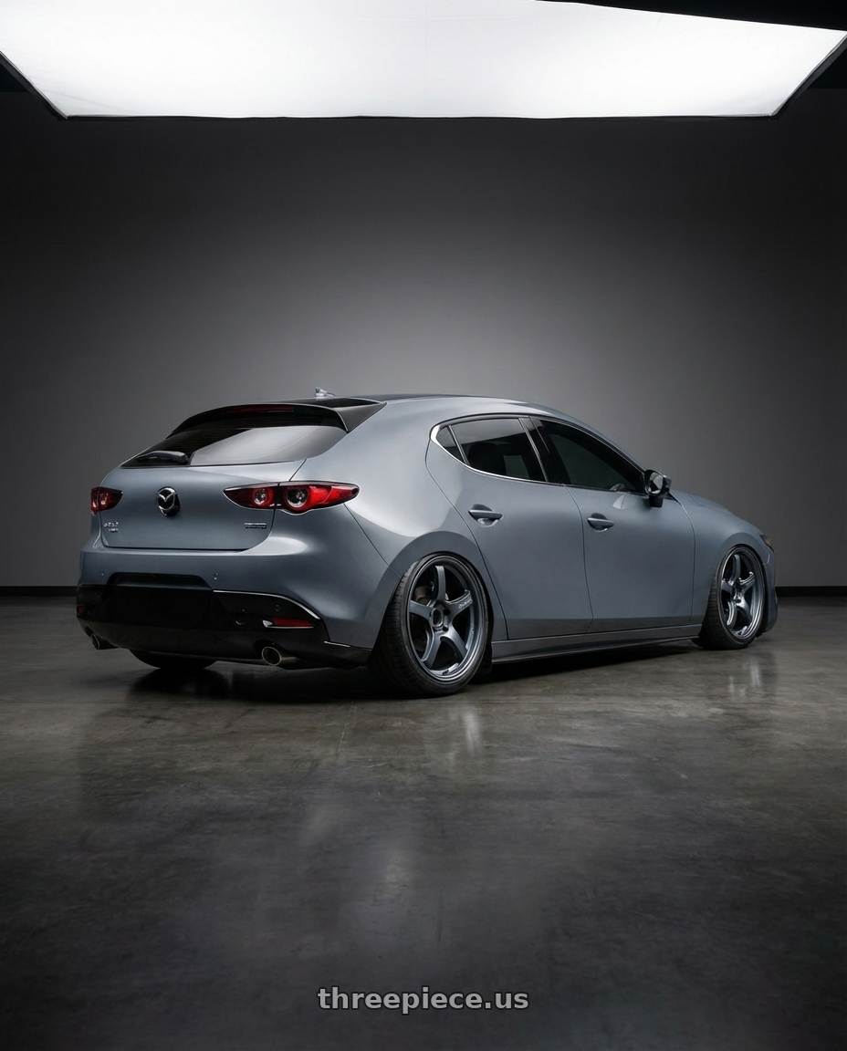 2023 Mazda Mazda3 Turbo with Gram Lights 57CR 5x114.3 18x9.5+22 Gunblue II wheels rear three quarter view slight stretch tires