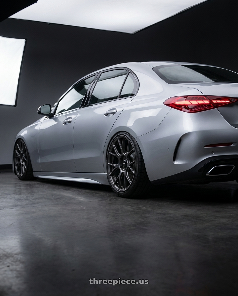 2022 Mercedes-Benz C-Class W206 with Konig Ampliform 5x112 19x8.5+32 Dark Metallic Graphite wheels rear three quarter view slight stretch tires