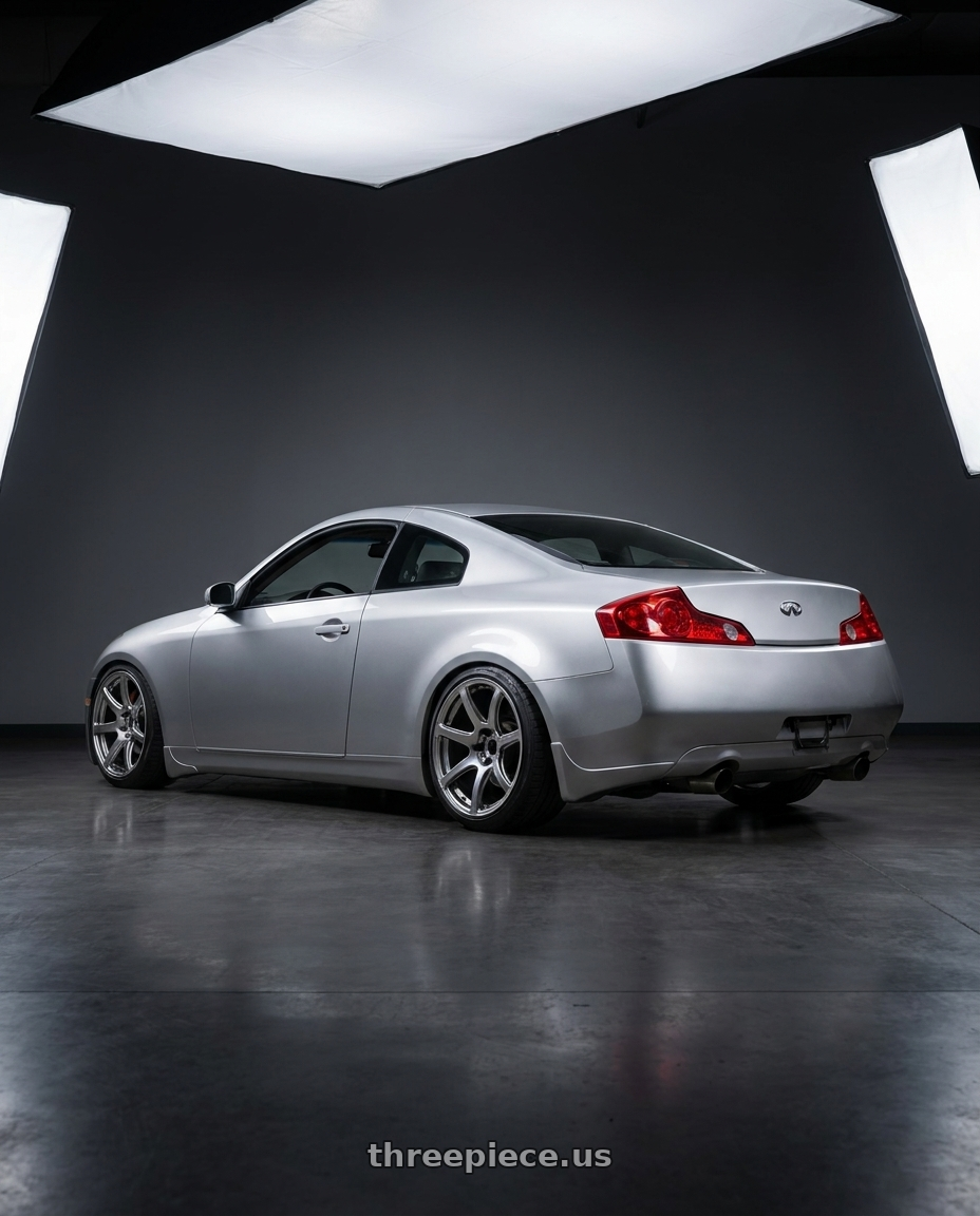 2005 infiniti g35 coupe, silver with Work Emotion T7r 5x100 18x10.5 +12 Gt Silver wheels rear three quarter view slight stretch tires