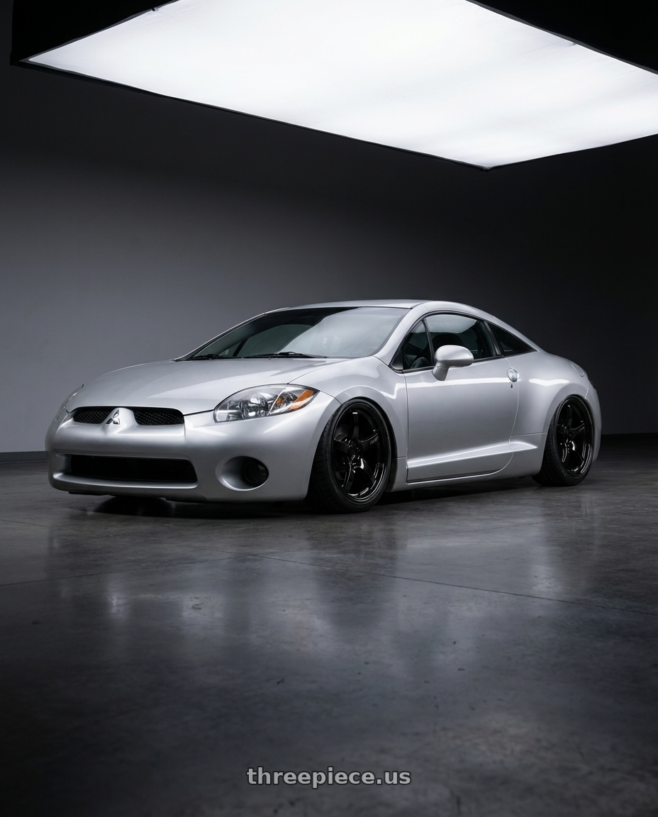 2010 Mitsubishi Eclipse with Gram Lights 57CR 5x114.3 19x9.5+45 Glossy Black wheels front three quarter view stanced stance