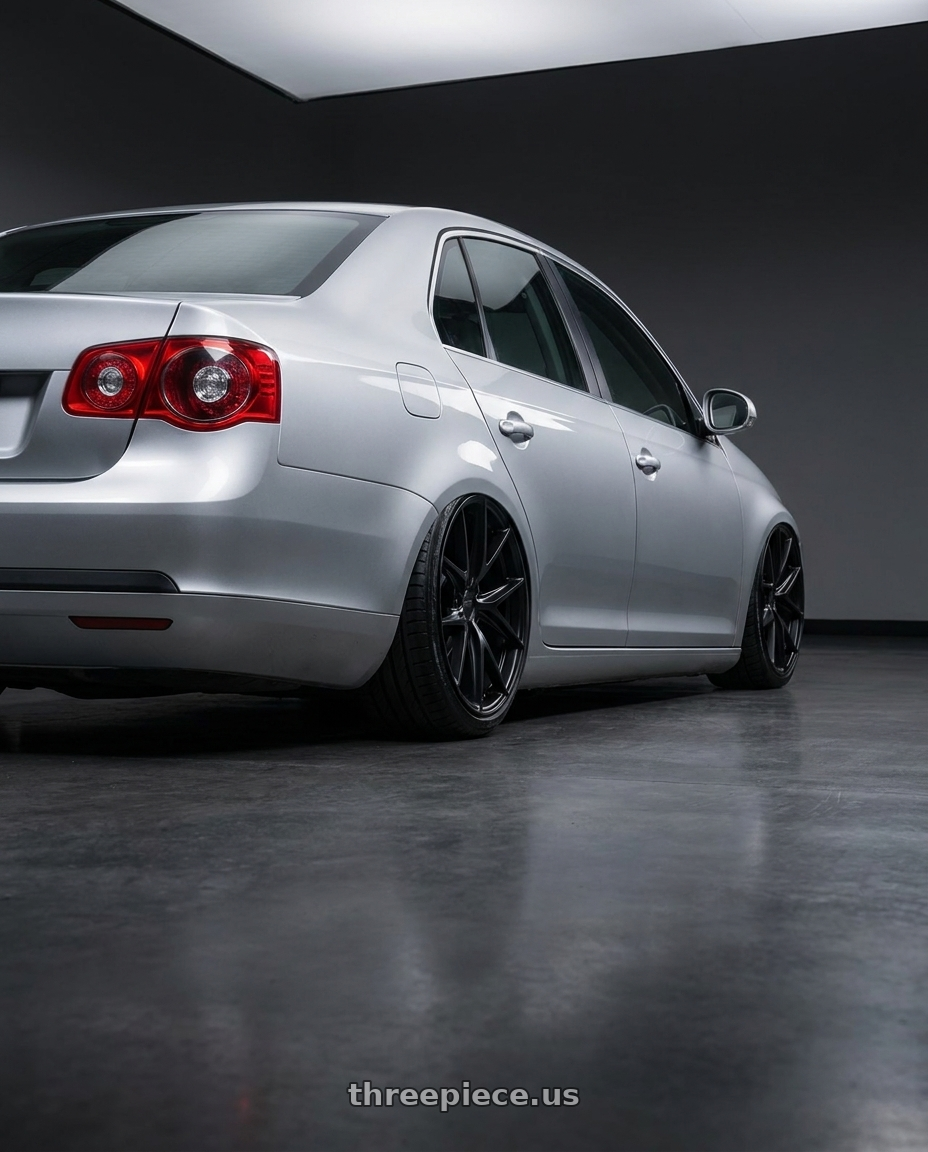 2009 Volkswagen Jetta GLI MK5 with Niche 1PC M117 MISANO 5X112 18X8 +42 MATTE BLACK wheels rear three quarter view slight stretch tires