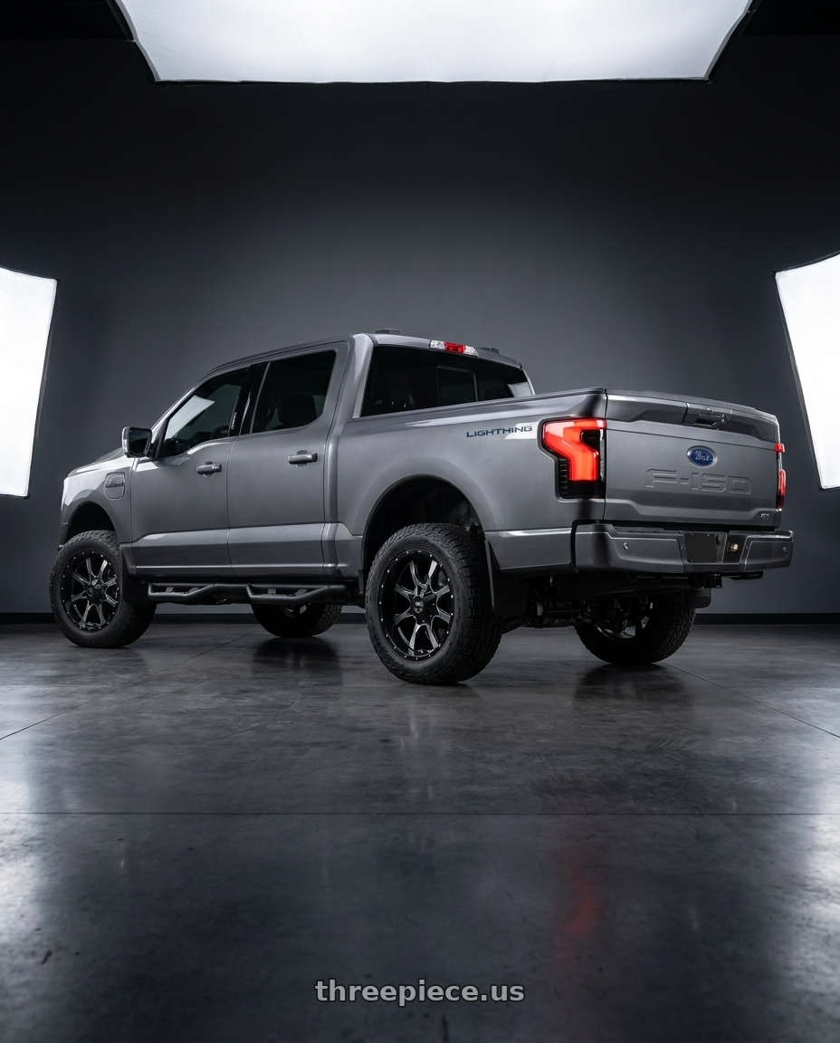 2022 ford lightning with Moto Metal MO970 6X135/6X139.7 20X9 +12 SEMI GLOSS BLACK MILLED wheels rear three quarter view slight stretch tires