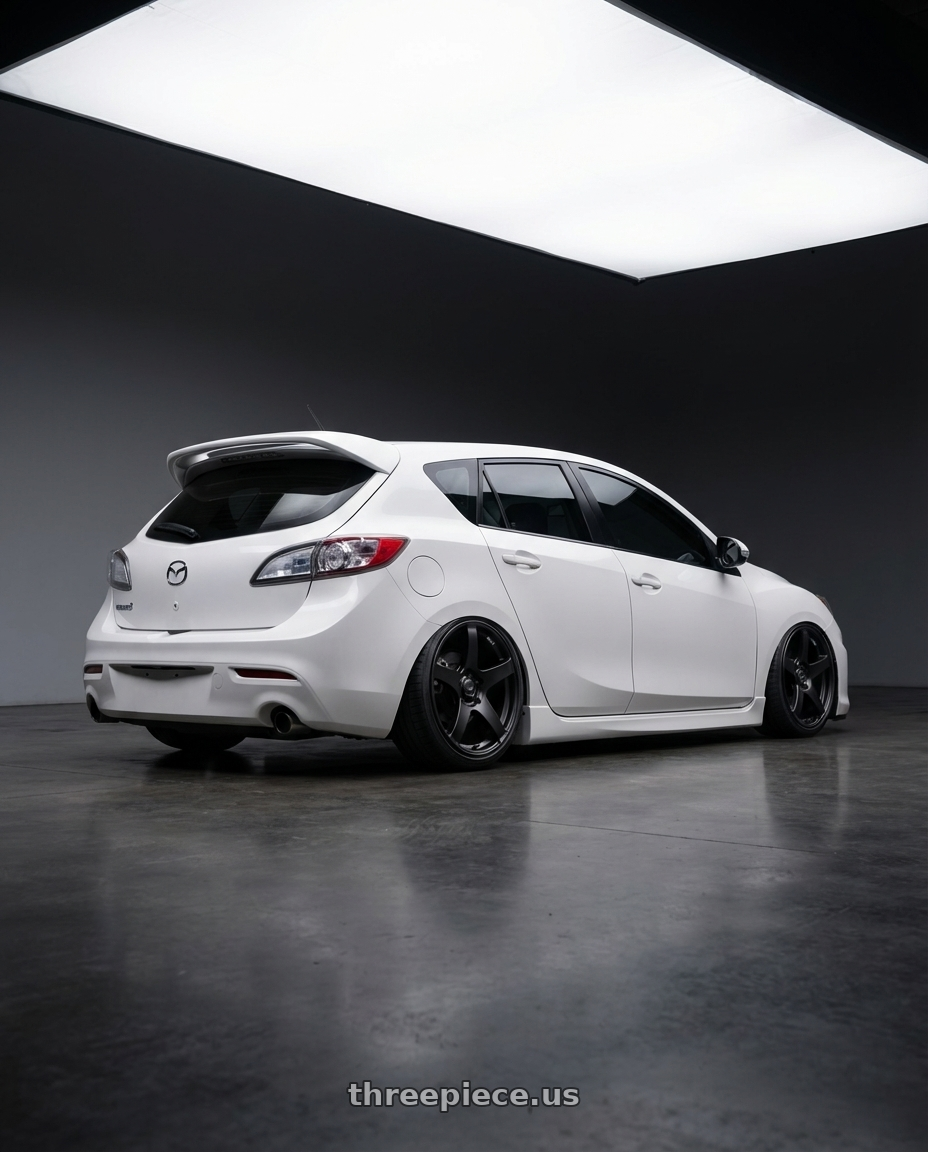 2012 Mazda Mazdaspeed3 with Ssr Gtv01 5x114.3 18x9+35  FLAT BLACK wheels rear three quarter view slight stretch tires