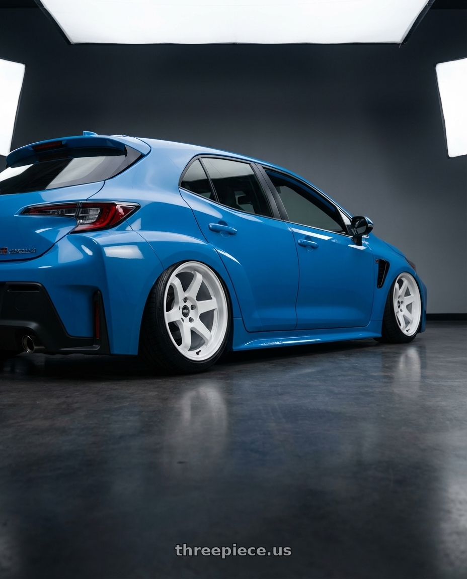 2024 Toyota GR Corolla with ESR Wheels APEX SERIES AP6 5x114.3 18x9.5 +35 Gloss White wheels rear three quarter view slight stretch tires