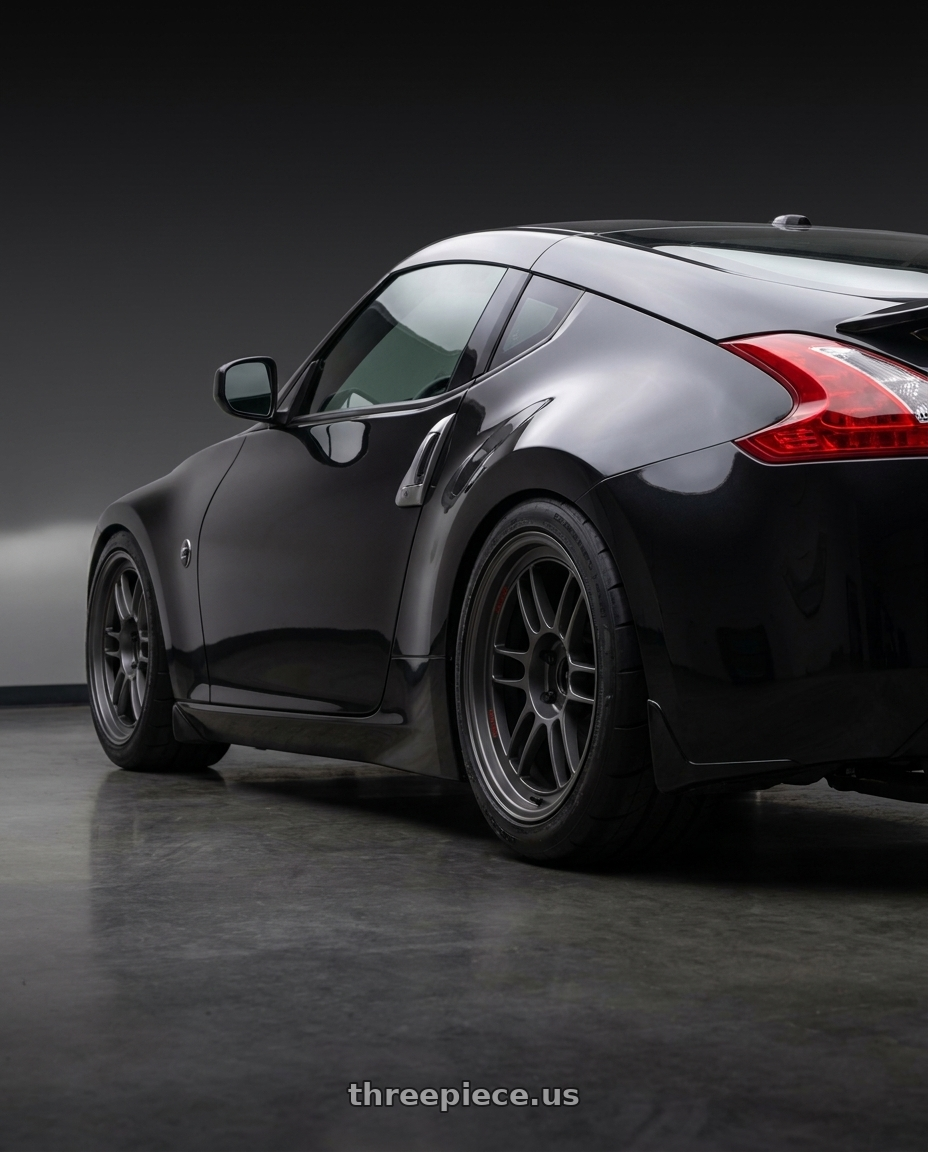 2009 Nissan 370z Magnetic Back Metallic with Enkei RPF1RS 5x114.3 18x10.5+10 Matte Gunmetal wheels rear three quarter view meaty tires