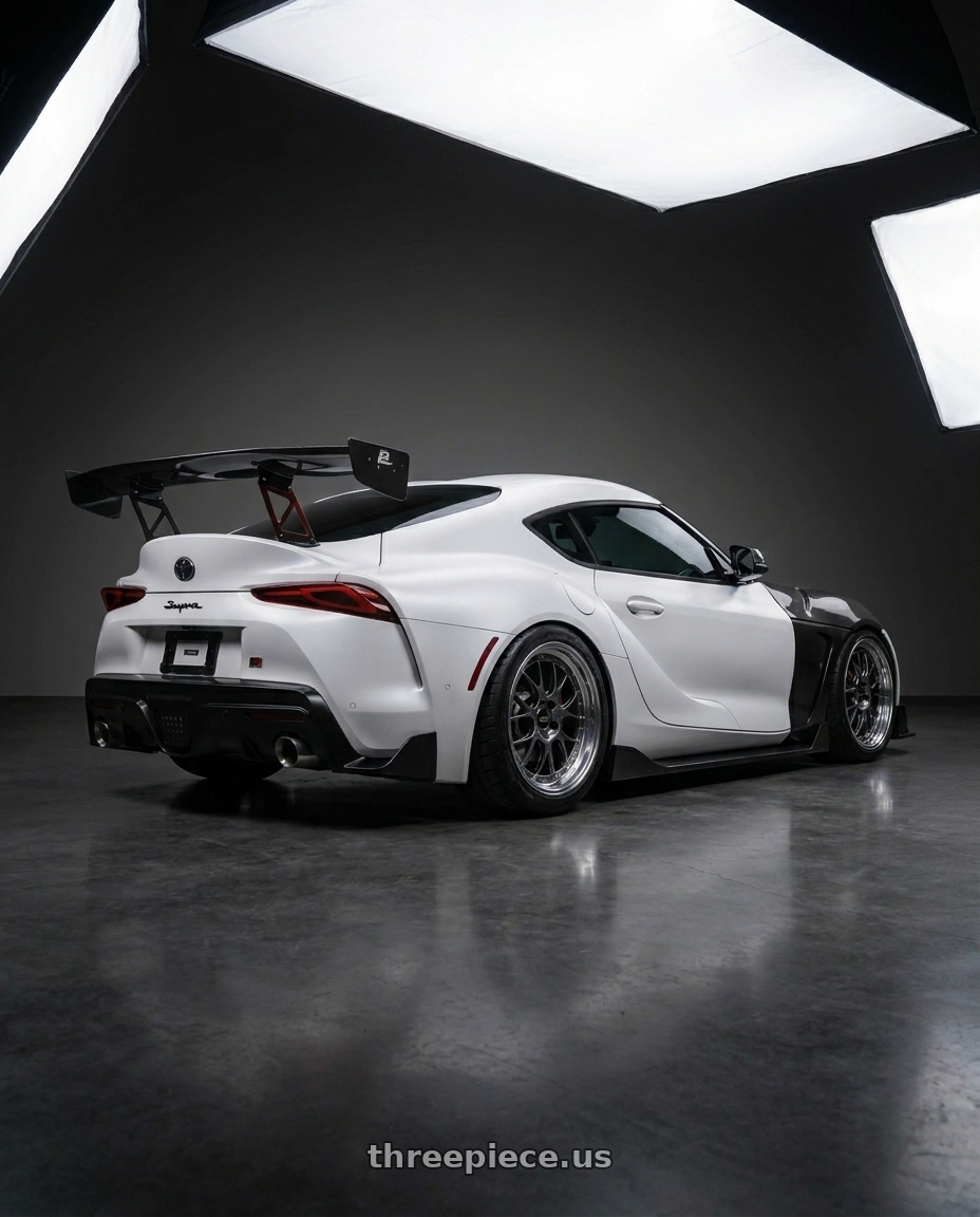 2022 A90 Supra Matt white with BBS RS-GT 5x130 18x11.0+45 Diamond Black wheels rear three quarter view meaty tires