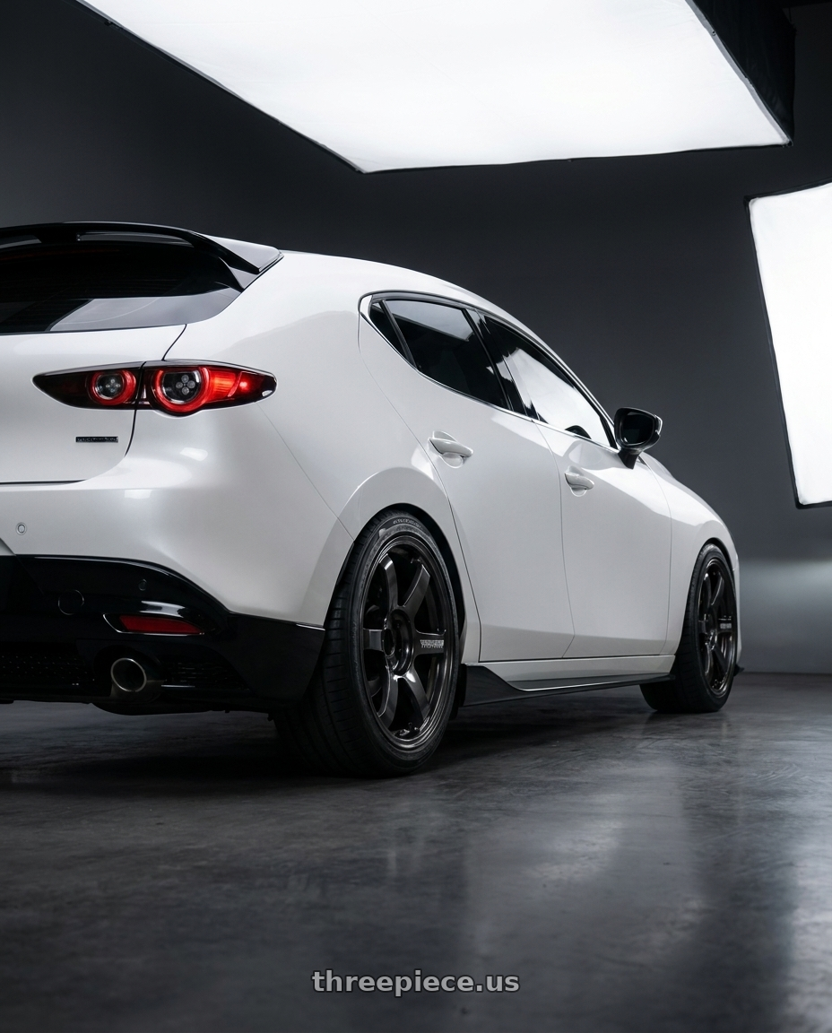 2024 Mazda3 Fastback  with Volk Racing TE37 Saga S-Plus 5x112 18x8.5+42 Diamond Dark Gunmetal wheels rear three quarter view square tires