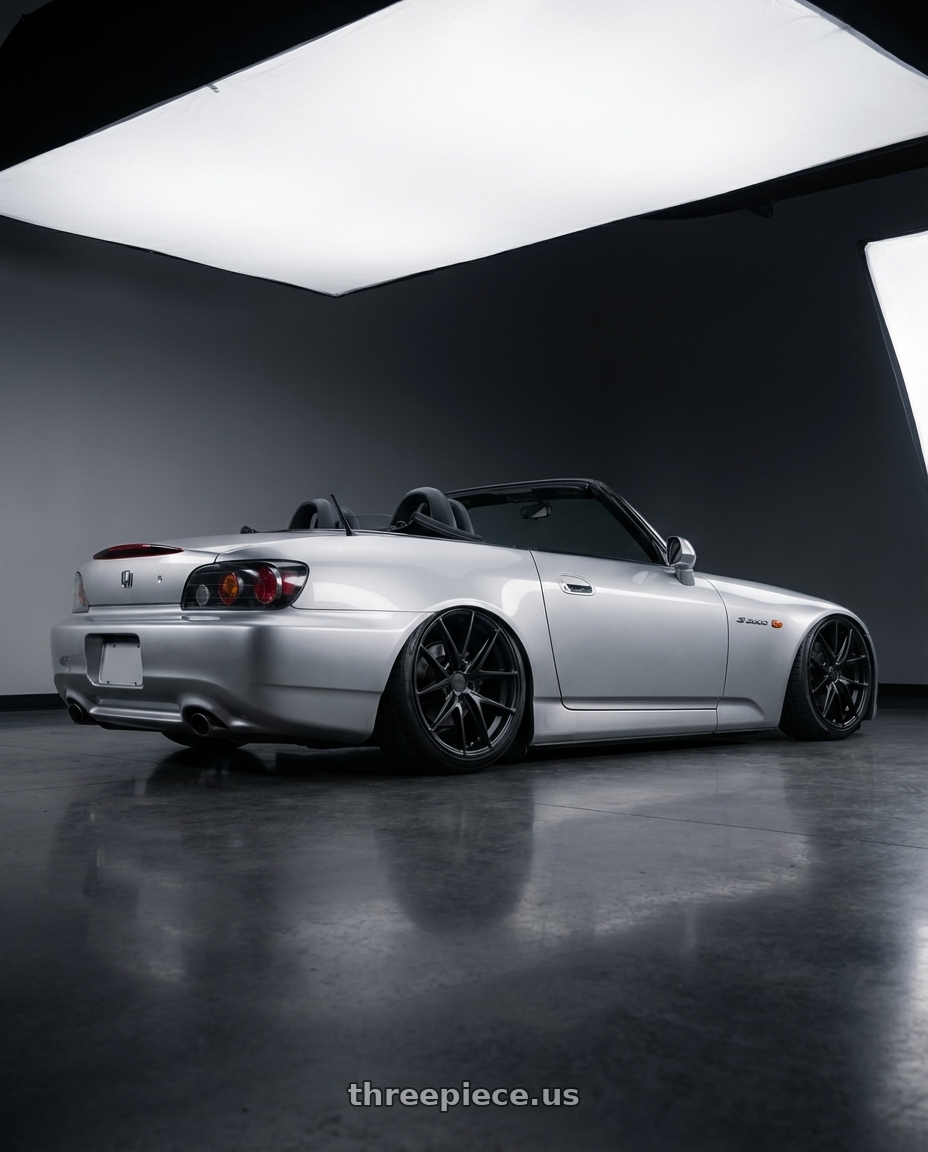 2009 Honda S2000 with Niche 1PC M117 MISANO 5X114.3 18X9.5 +40 MATTE BLACK wheels rear three quarter view slight stretch tires